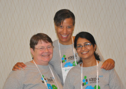 Photo: UXPA 2013 volunteers Susan Dray, Deirdre McGruder, and Mamta Gangapuri, are all smiles.